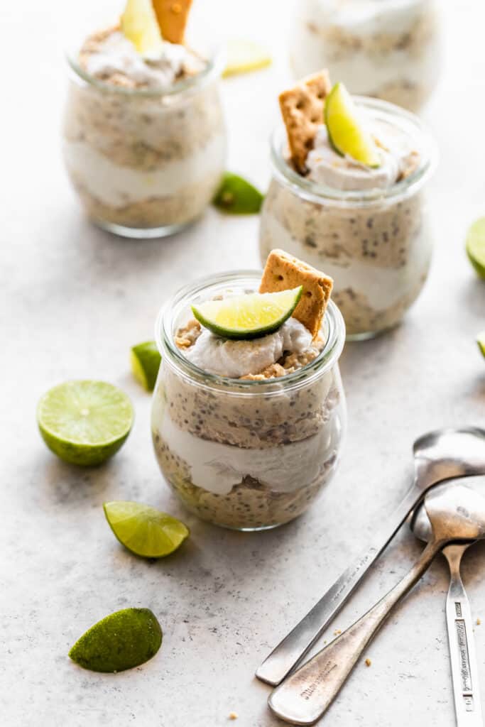 A group of key lime overnight oats in clear pots.