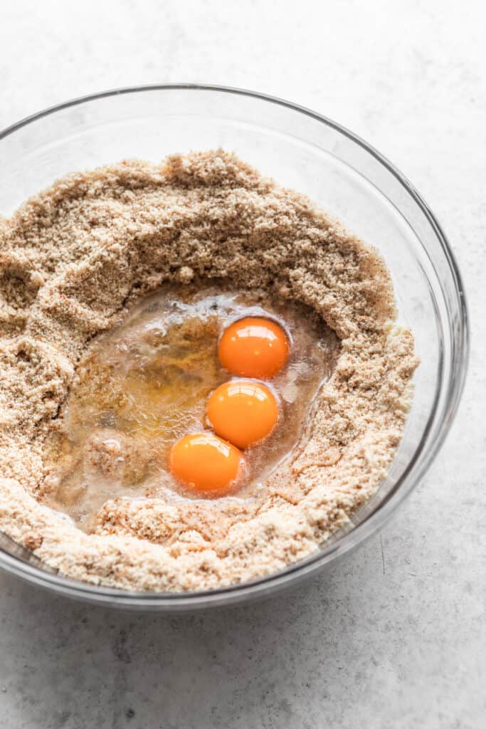 Eggs in a bowl with almond flour.