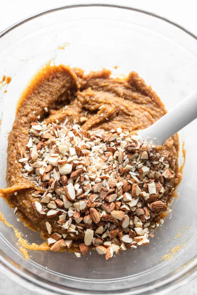Chopped almonds in cookie batter.