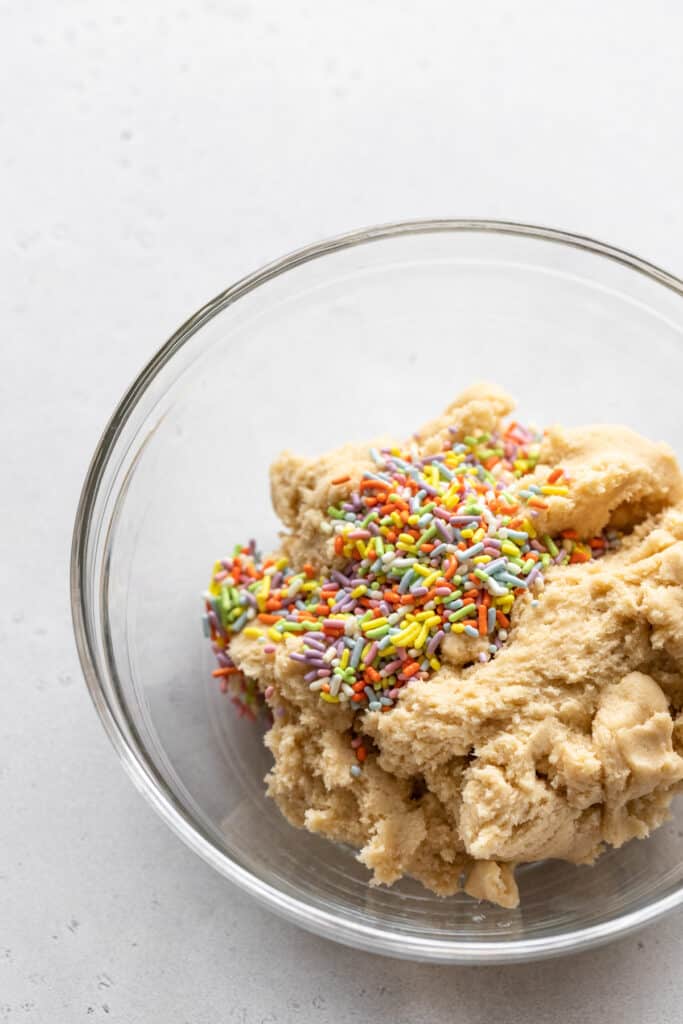 Cookie dough with sprinkles.