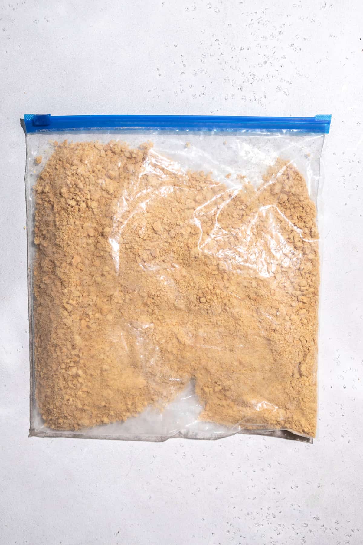 A plastic bag of graham cracker crumbs.