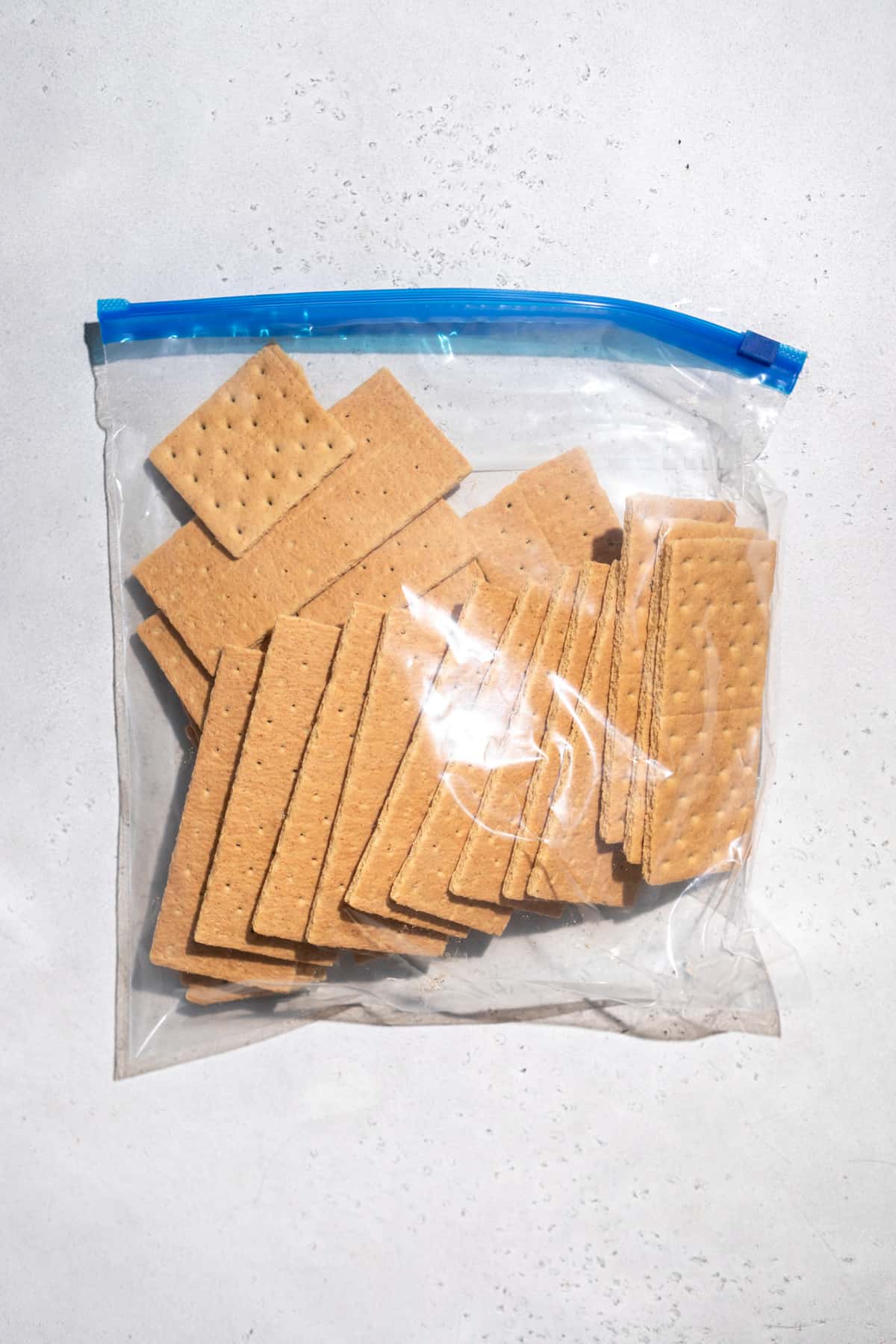 A plastic baggie of graham crackers.