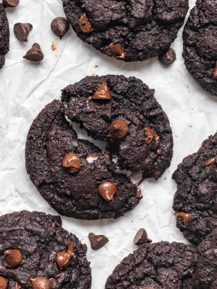 Double chocolate chip cookies on parchment paper.