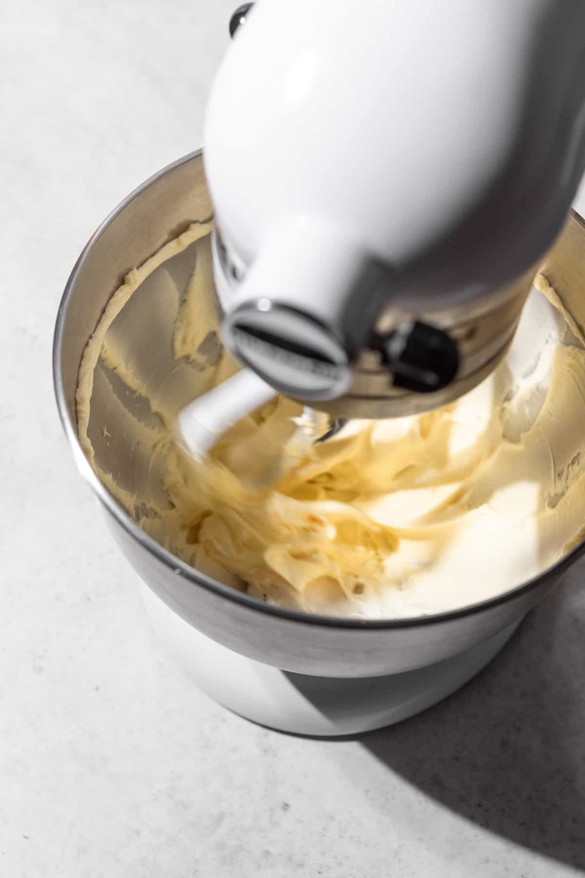 Butter being creamed in a stand mixer.