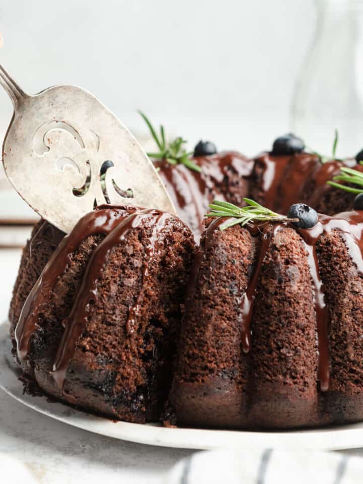 A blueberry chocolate bundt cake being served.
