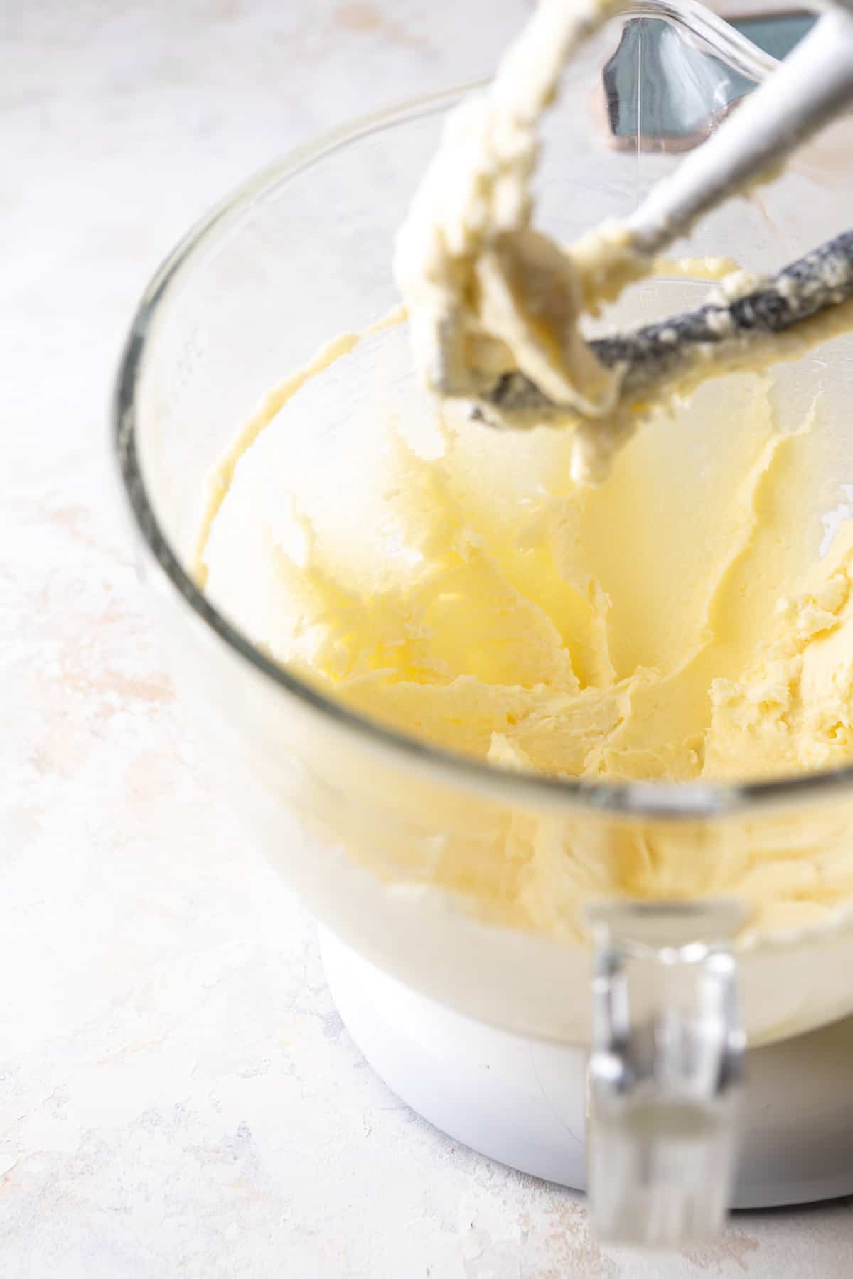 Butter and sugar creamed together in the bowl of a stand mixer.