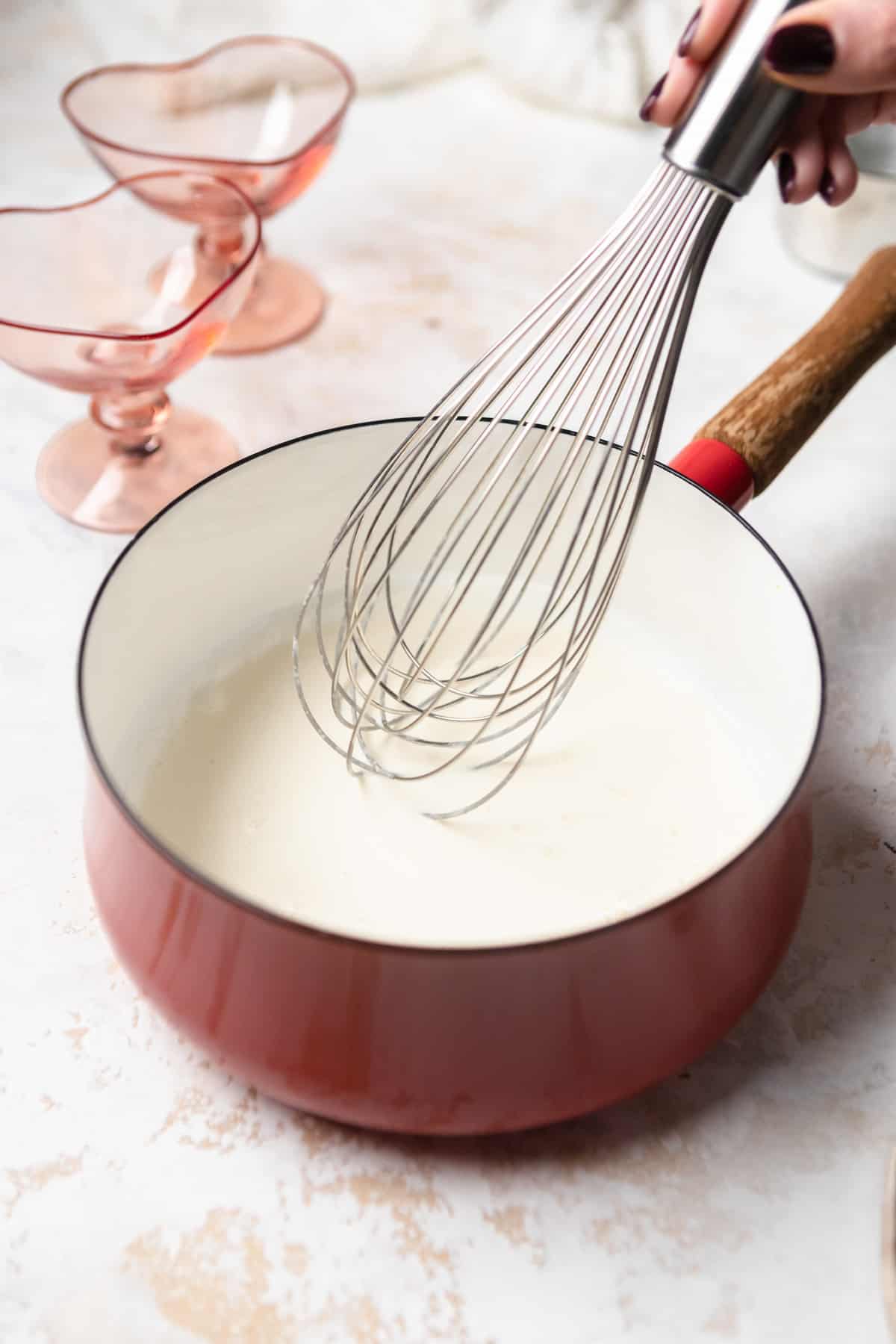 Heavy cream in a saucepan.