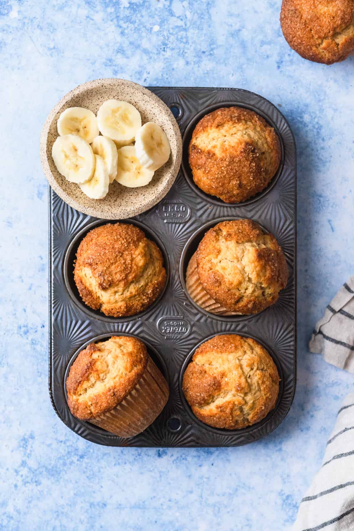 Overhead of small batch banana muffins in a tin.