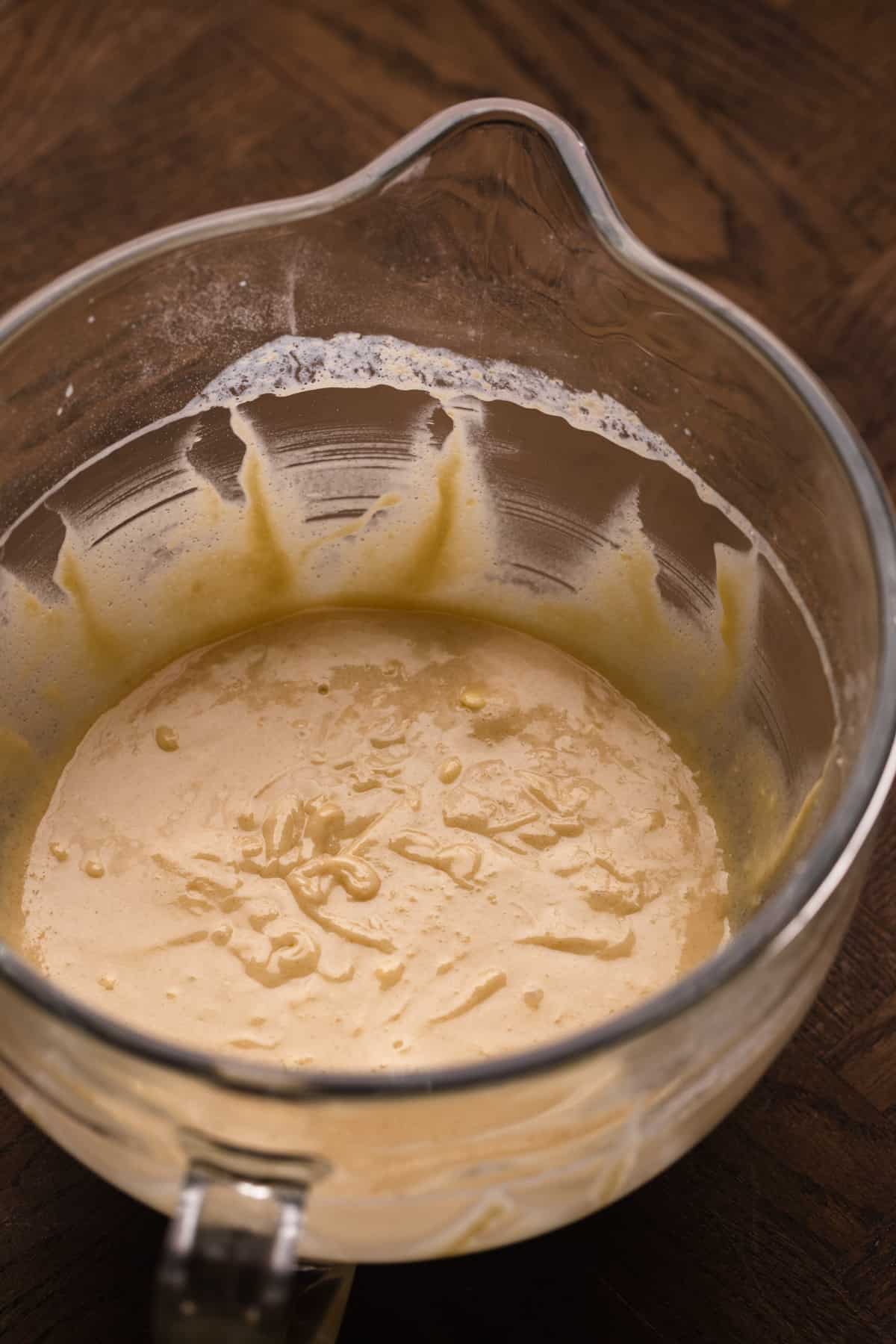 Cake batter in a glass mixing bowl.