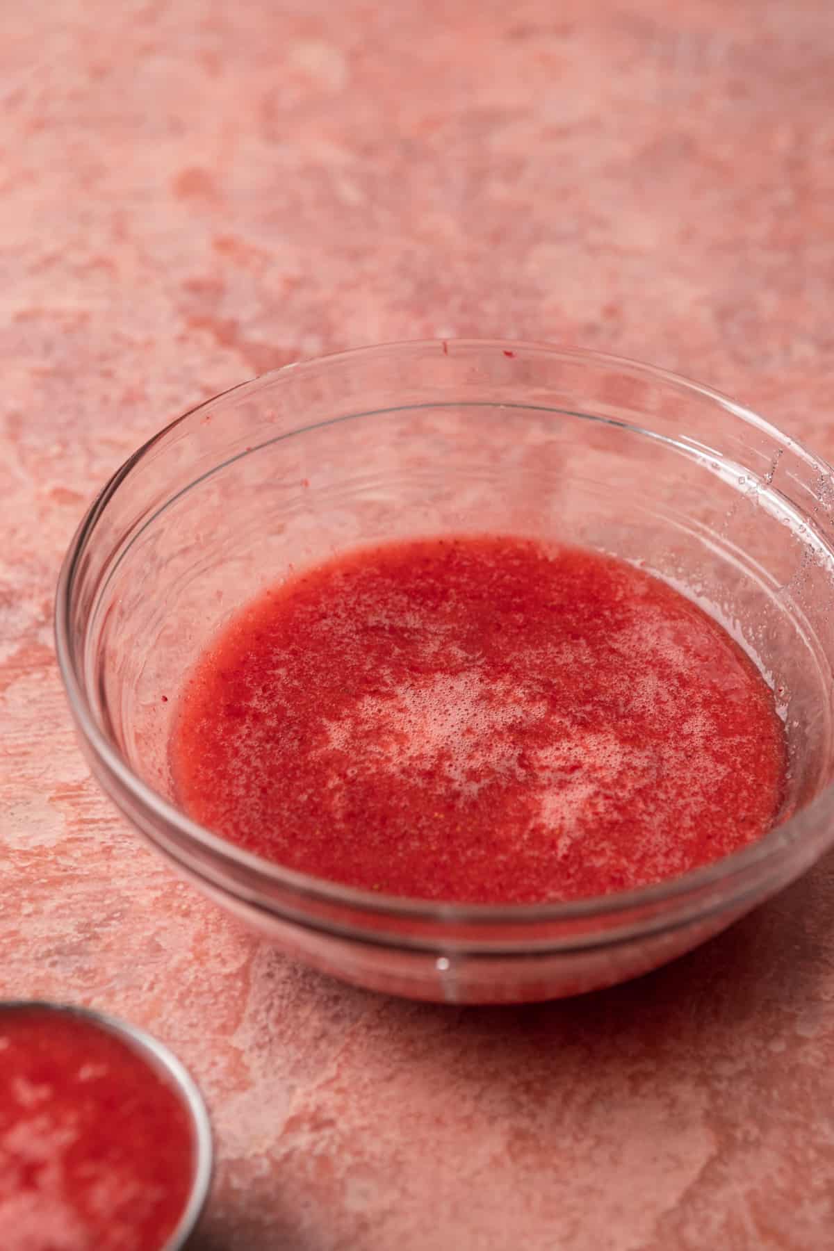 Strawberry puree in a bowl.