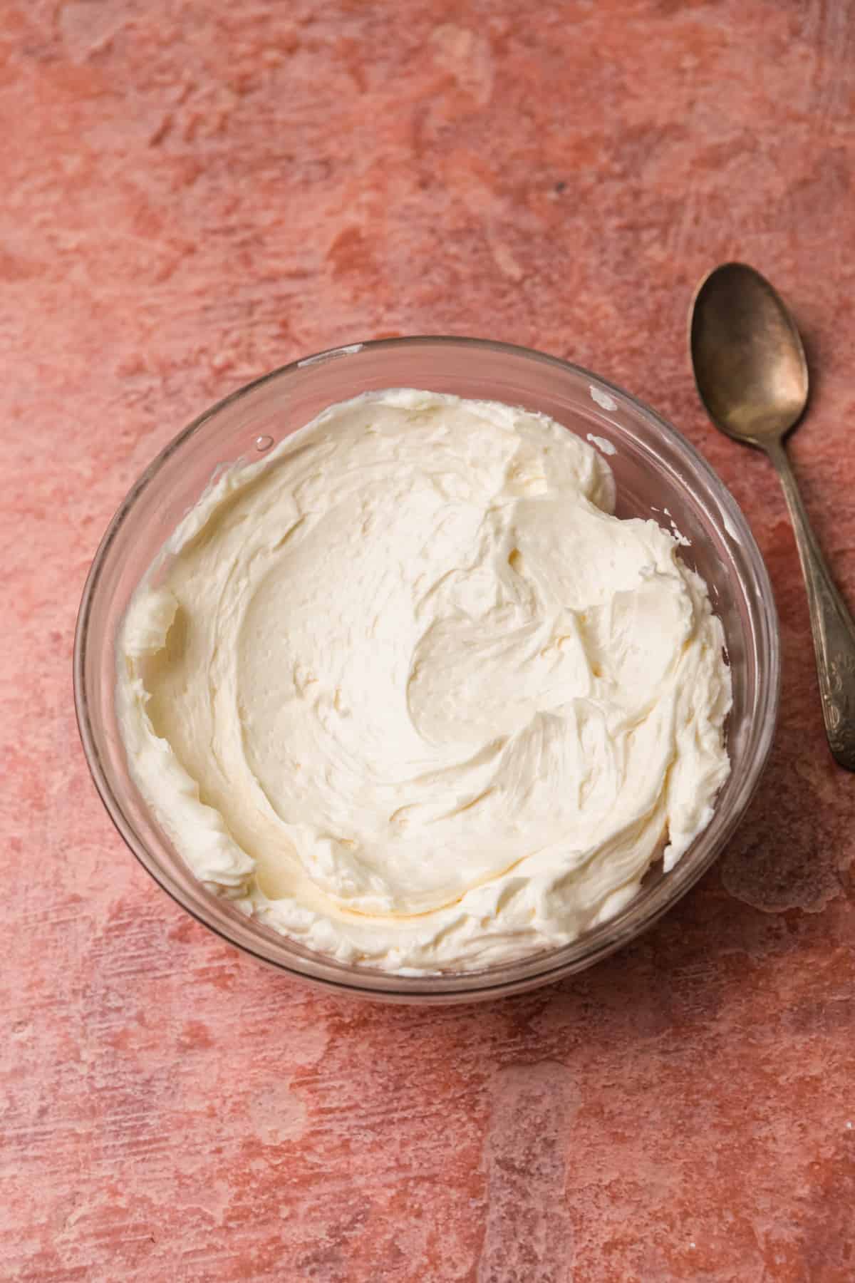 Faux Swiss meringue buttercream in a bowl with a spoon.