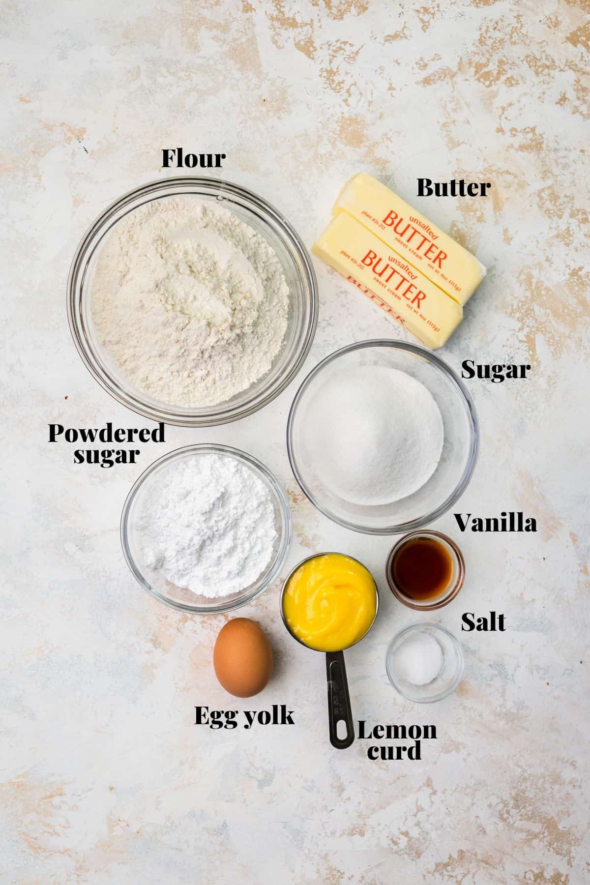 Ingredients to make lemon bar cookies on a table.