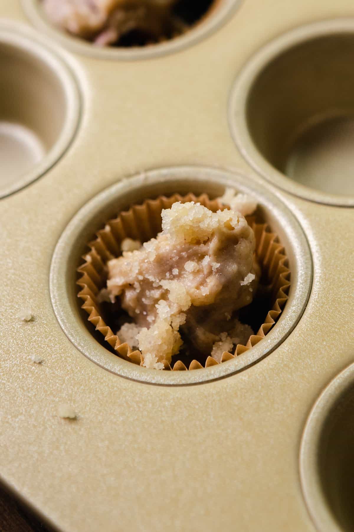 Muffin batter in a mini muffin pan.