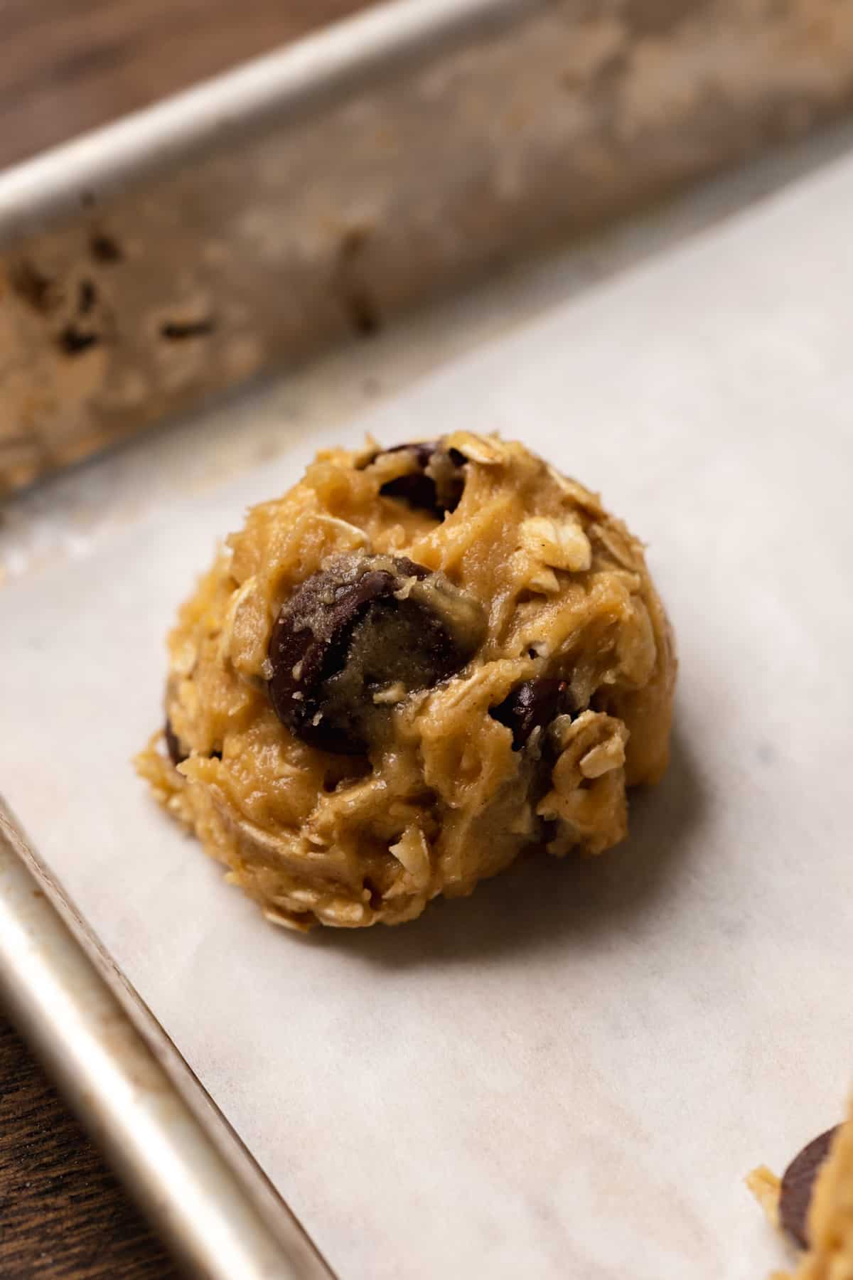 Small batch oatmeal chocolate chip cookie dough on parchment paper.