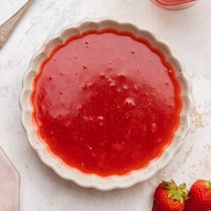 Strawberry cake filling in a bowl.