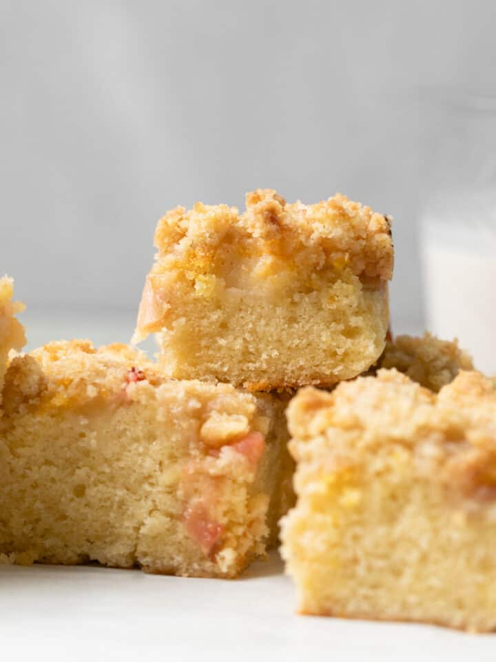 Slices of rhubarb crumb cake on top of each other.
