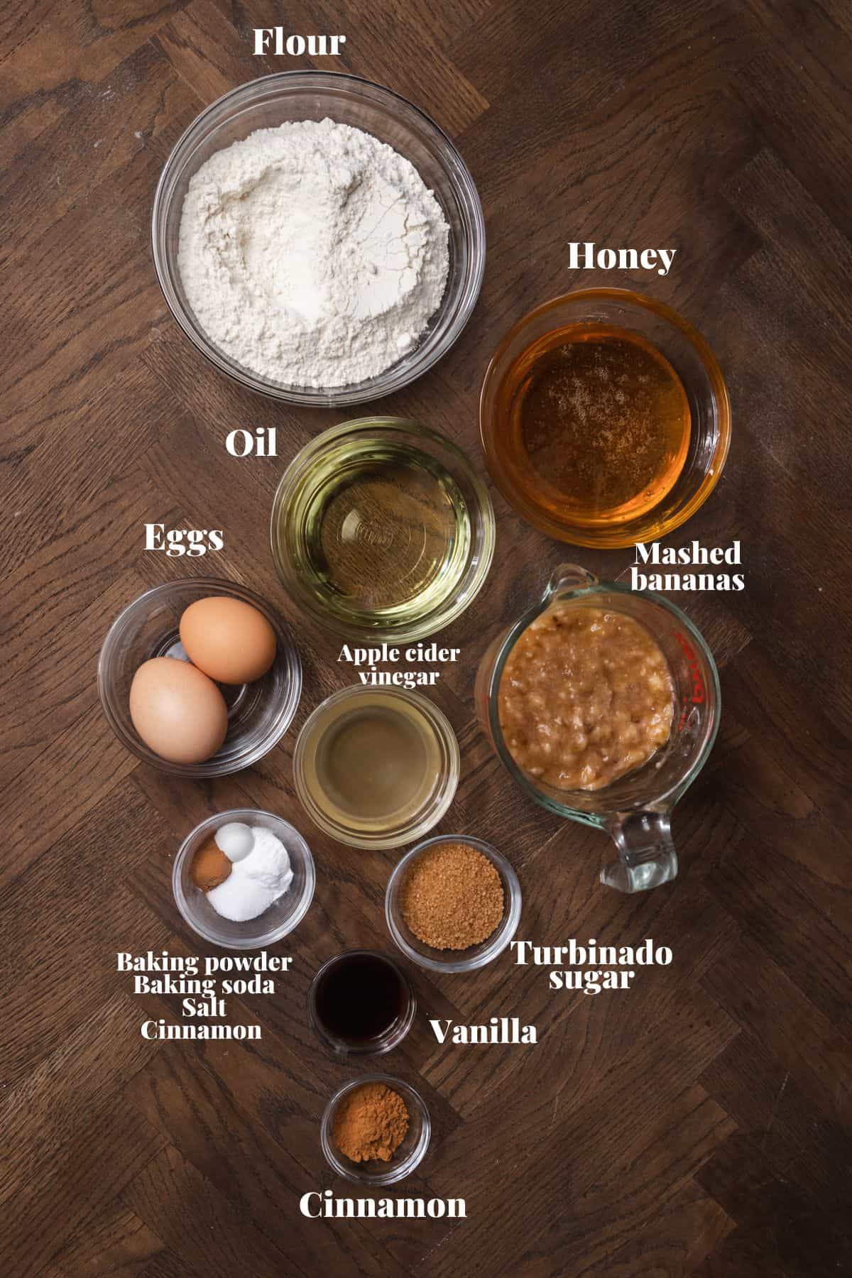 Ingredients to make banana bread on a wooden surface.