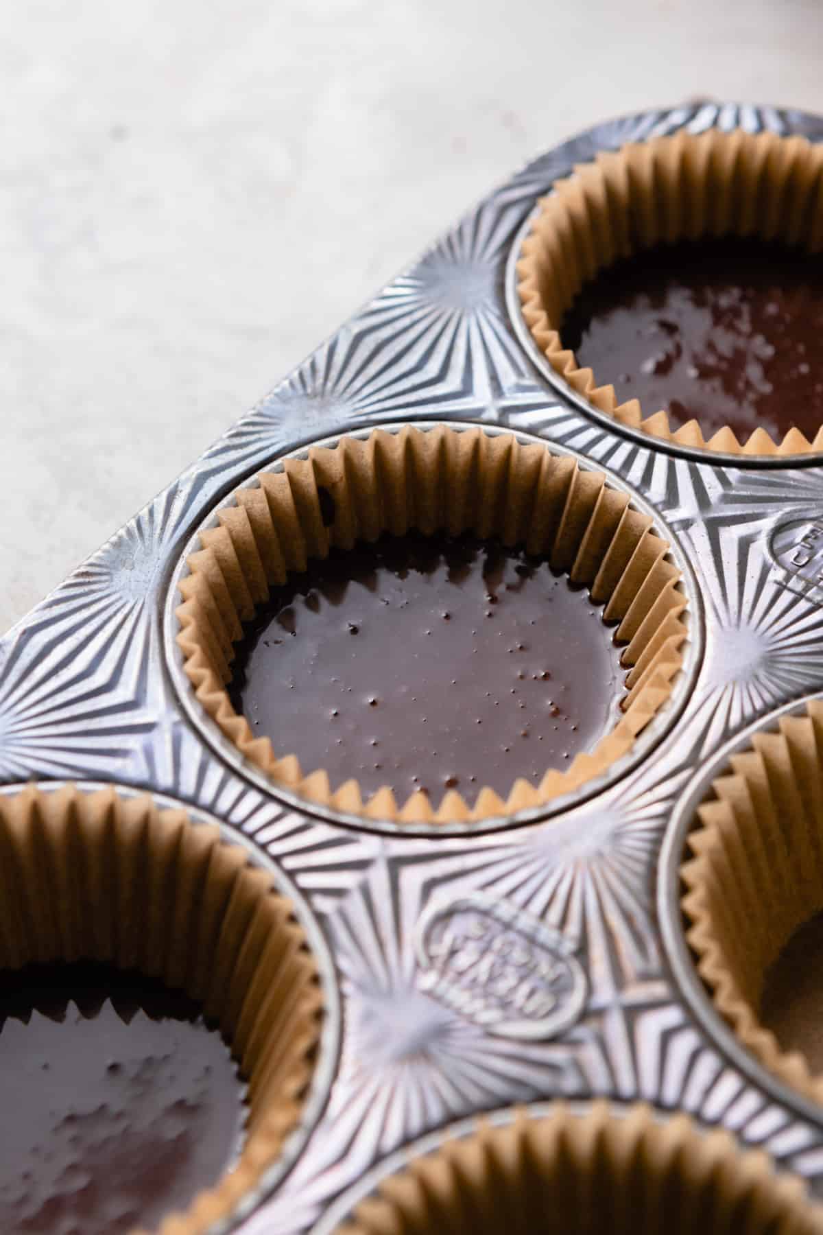 Cupcake batter in a pan.