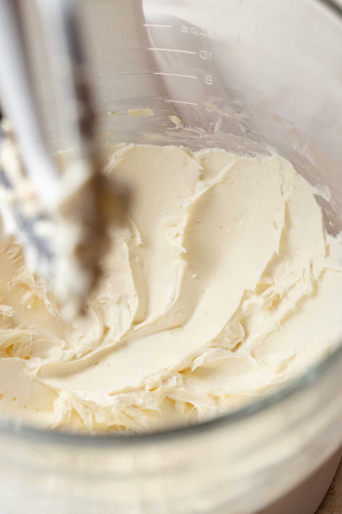Mixed cream cheese in a stand mixer bowl.