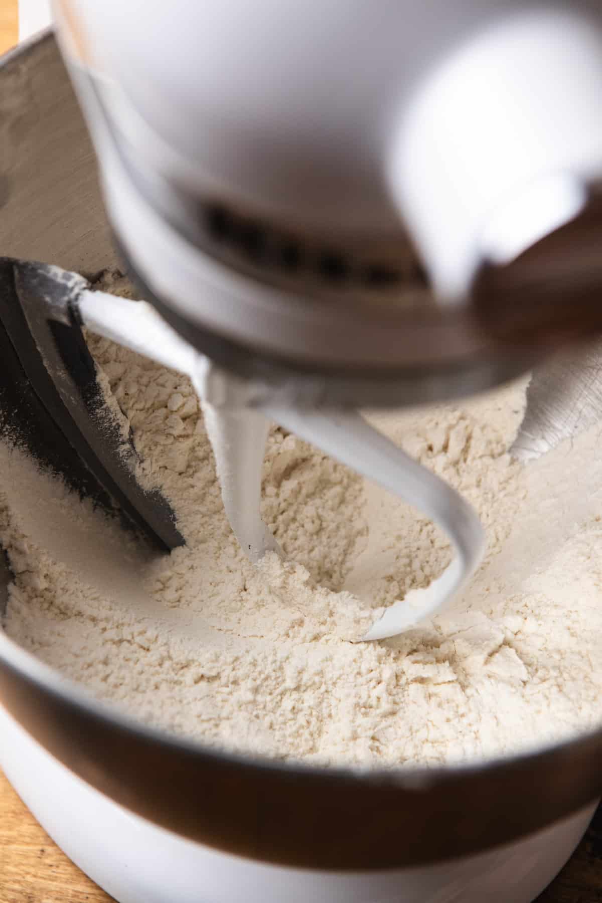 Flour and sugar in a stand mixer.