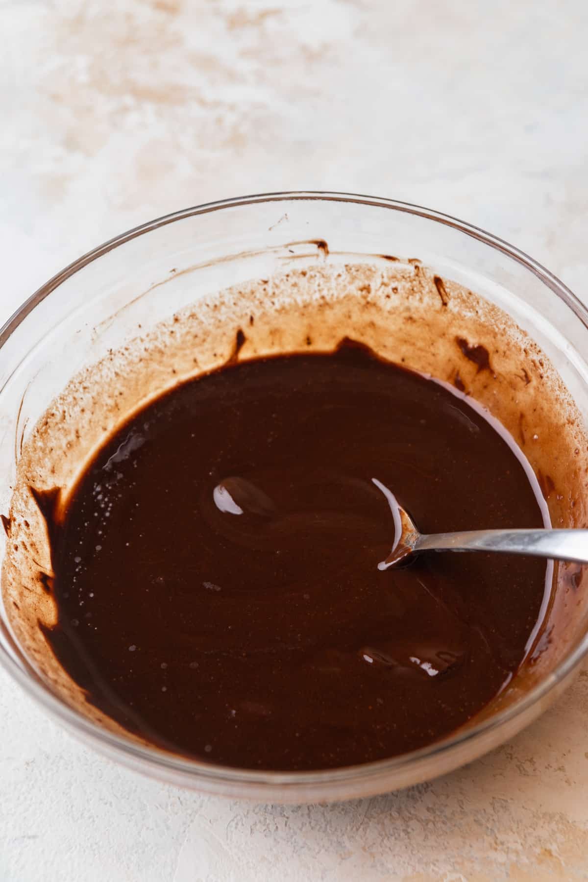 Melted chocolate and butter in a bowl.