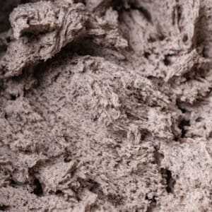 A close up photo of oreo cream cheese frosting.