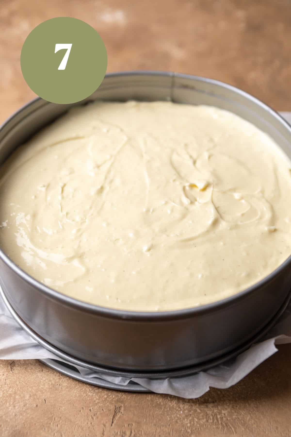 White chocolate cheesecake batter in a springform pan.