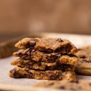 Milk chocolate chip cookie stack of a baking tray.