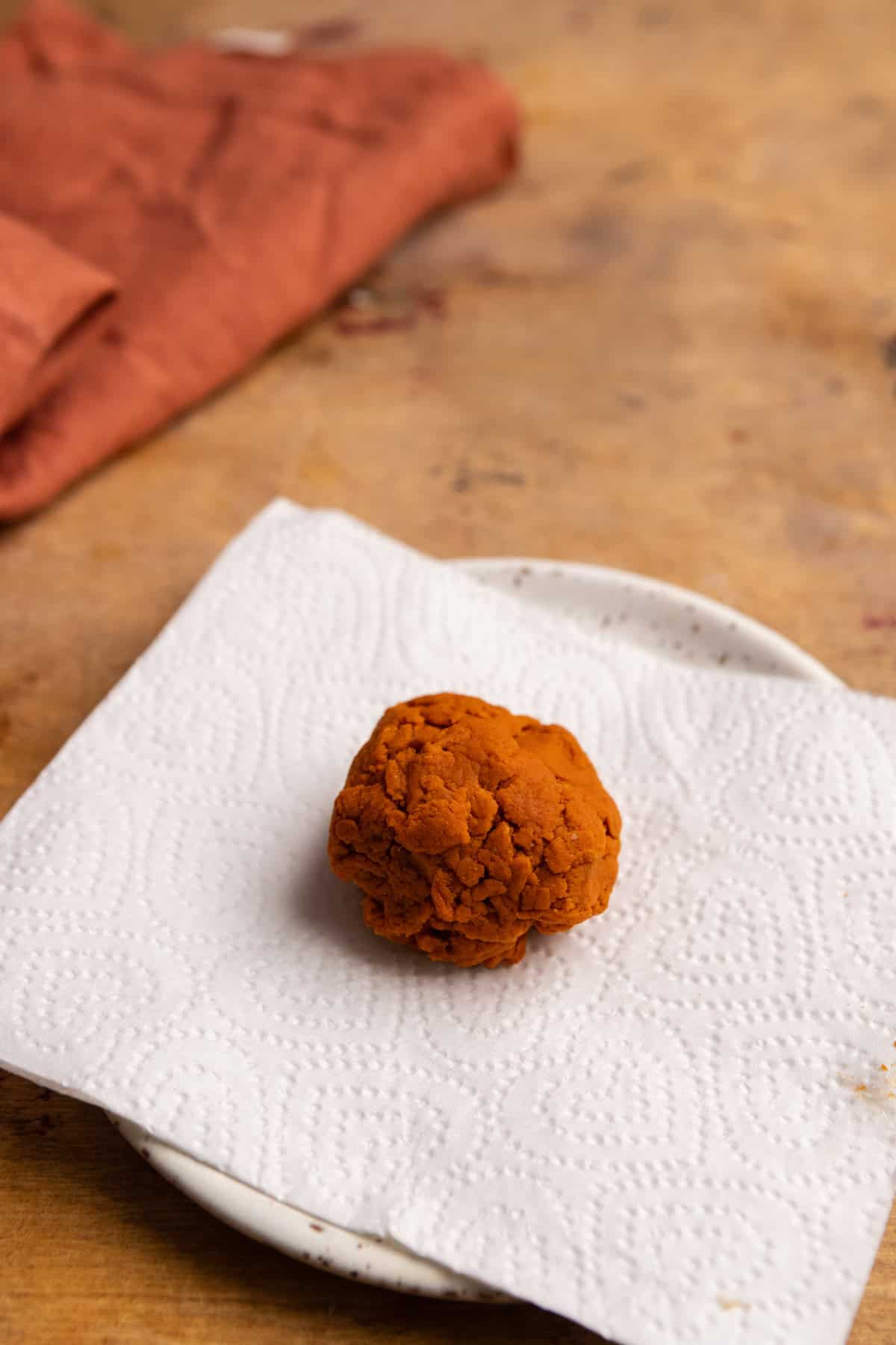 Dried pumpkin on a white plate with a napkin.