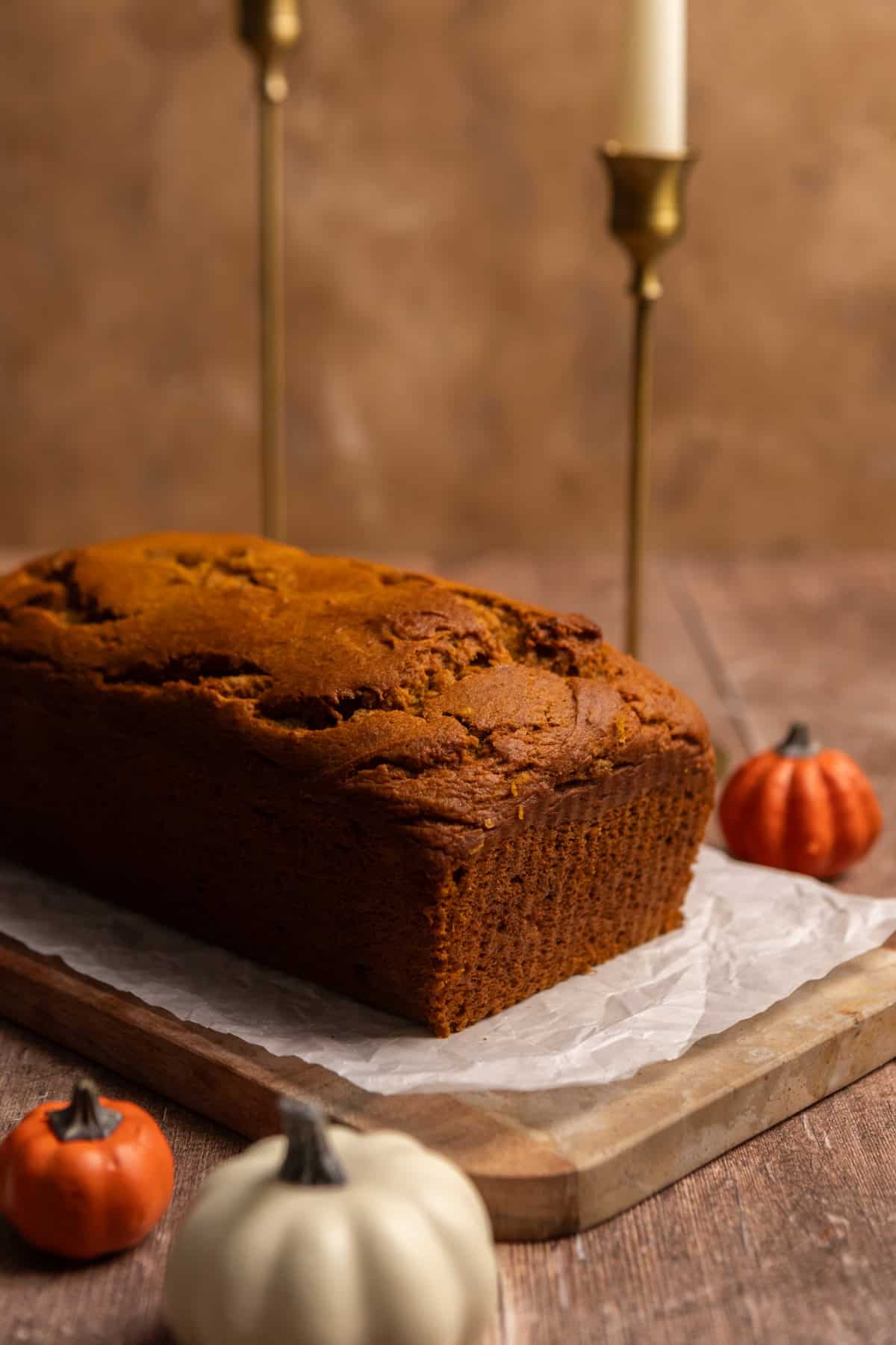 An unfrosted loaf of pumpkin bread.