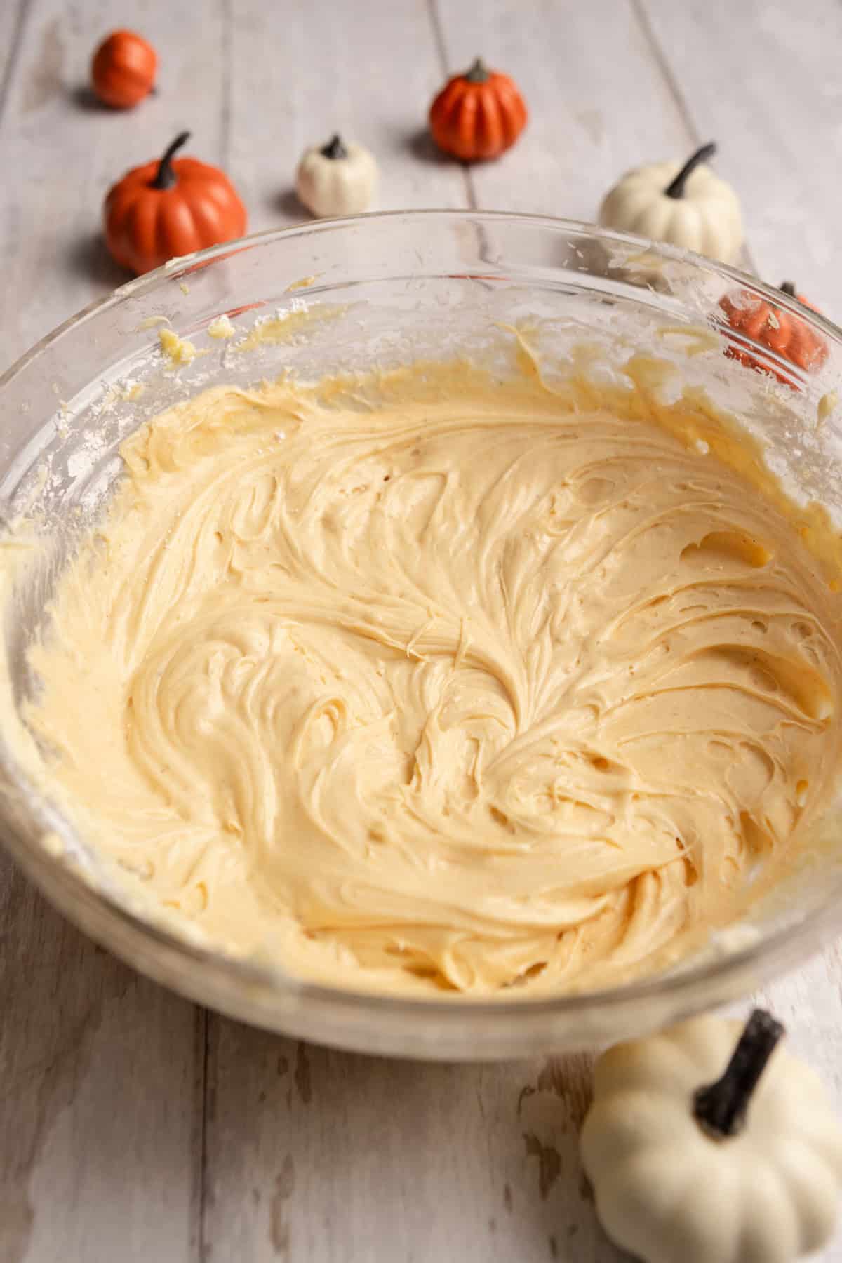 Pumpkin cream cheese frosting in a bowl.