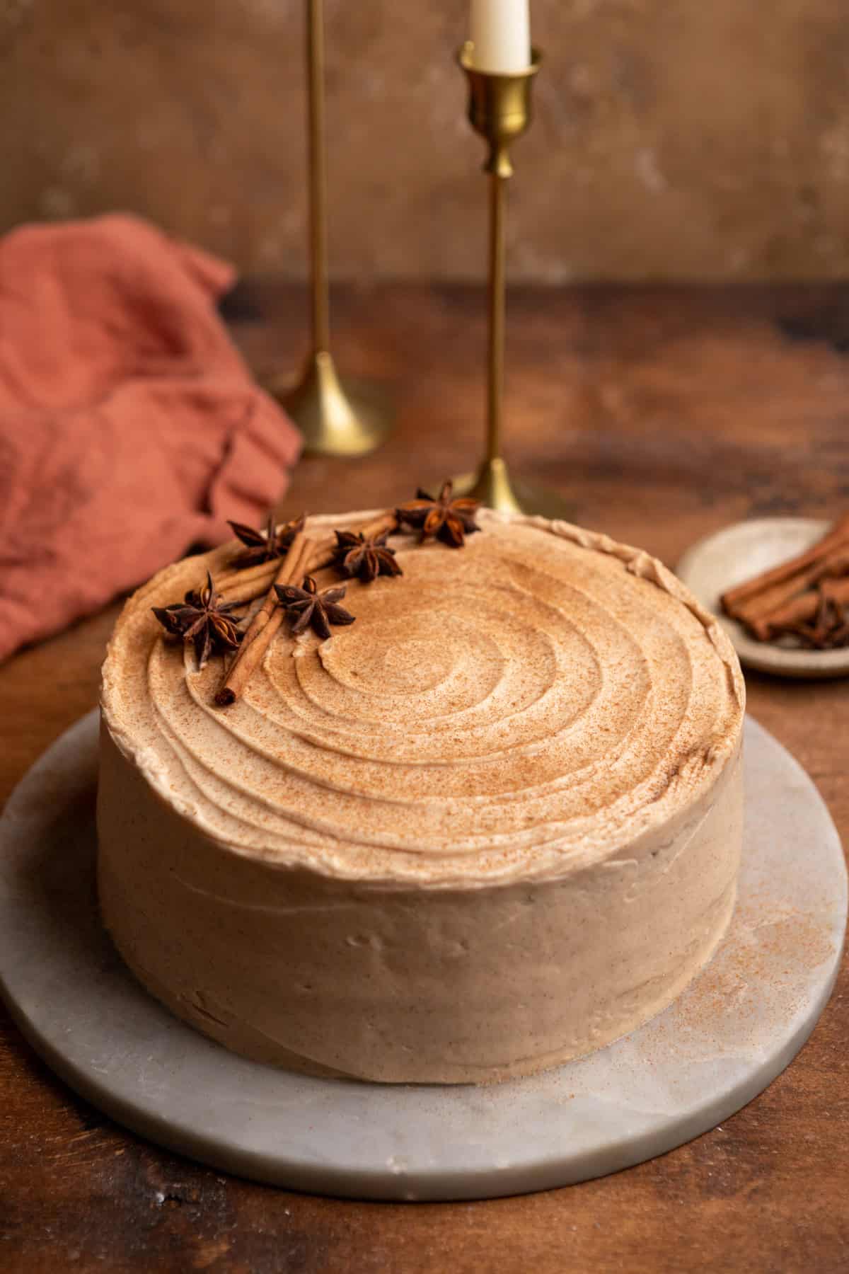 A spiced chai cake on a marble platter.