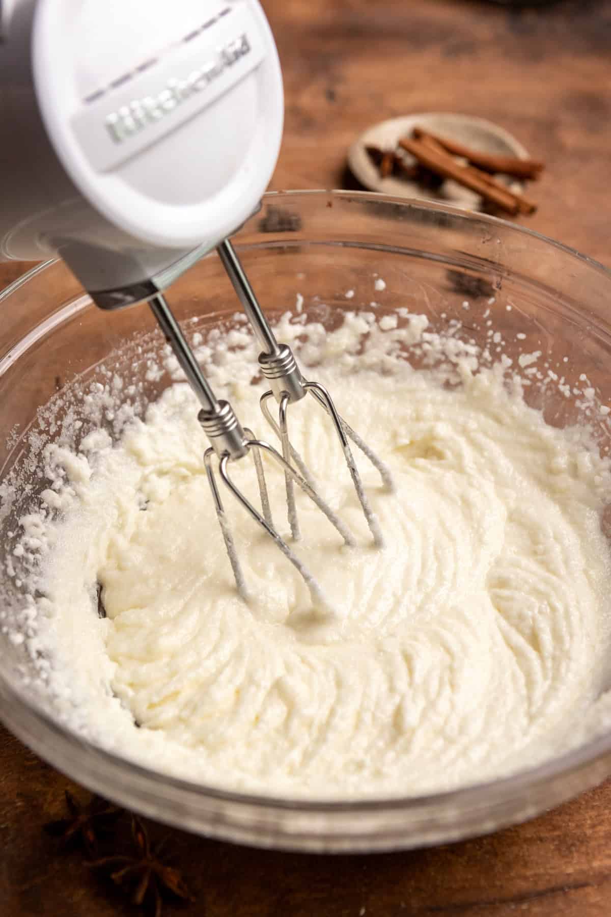 Creamed butter, oil, and sugar in a mixing bowl.