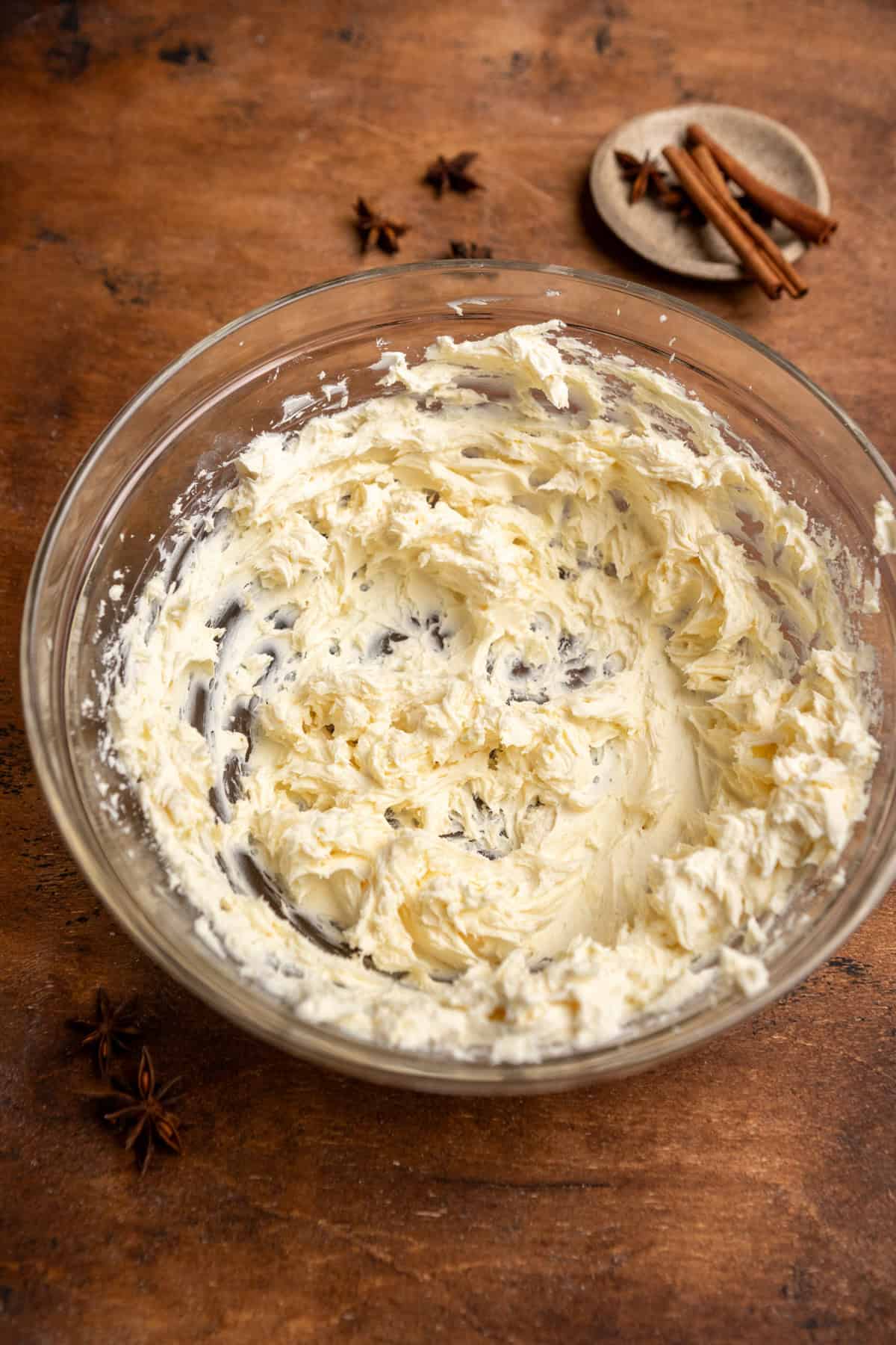 Butter and cream cheese mixed together in a glass bowl.