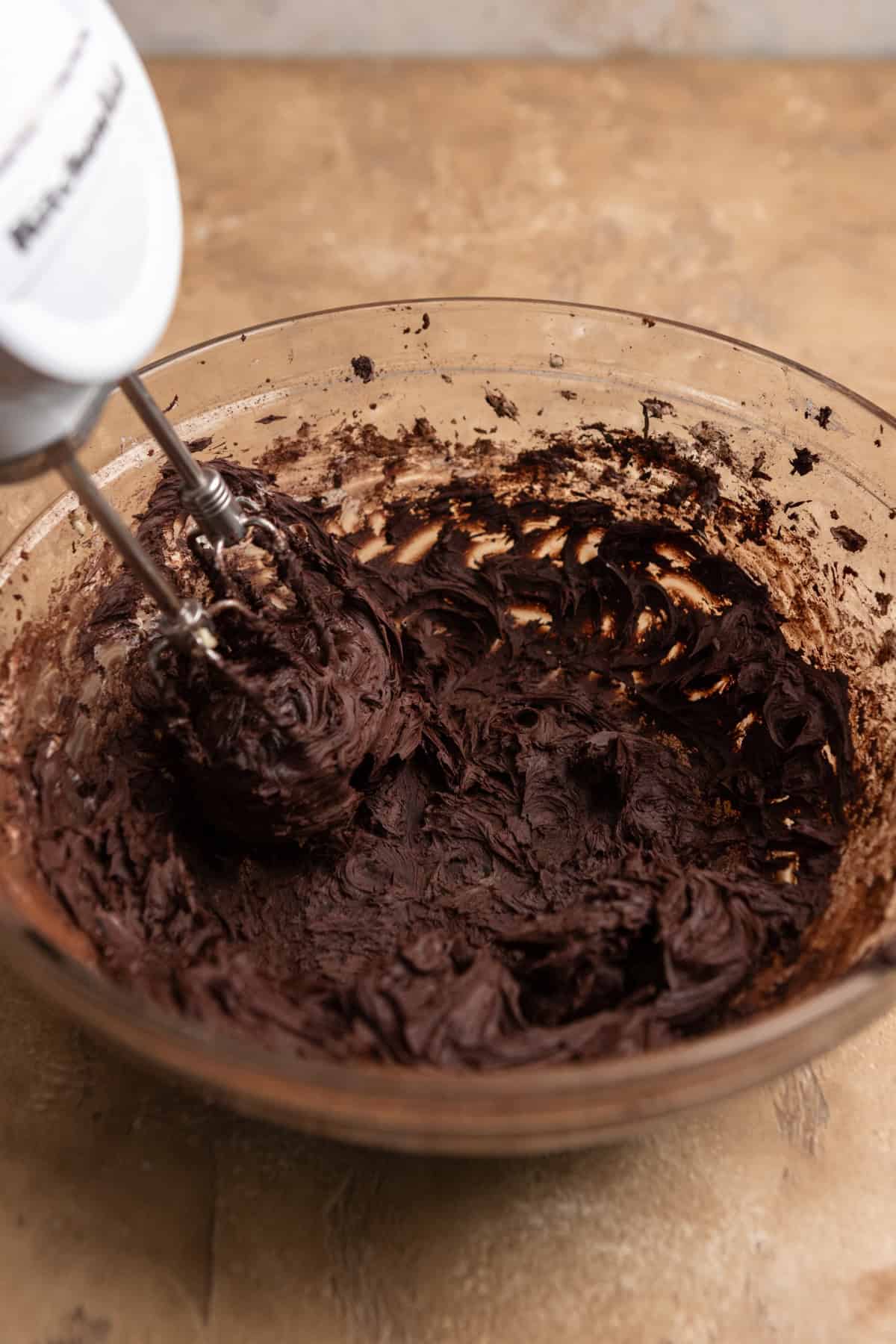 Chocolate frosting in a bowl.