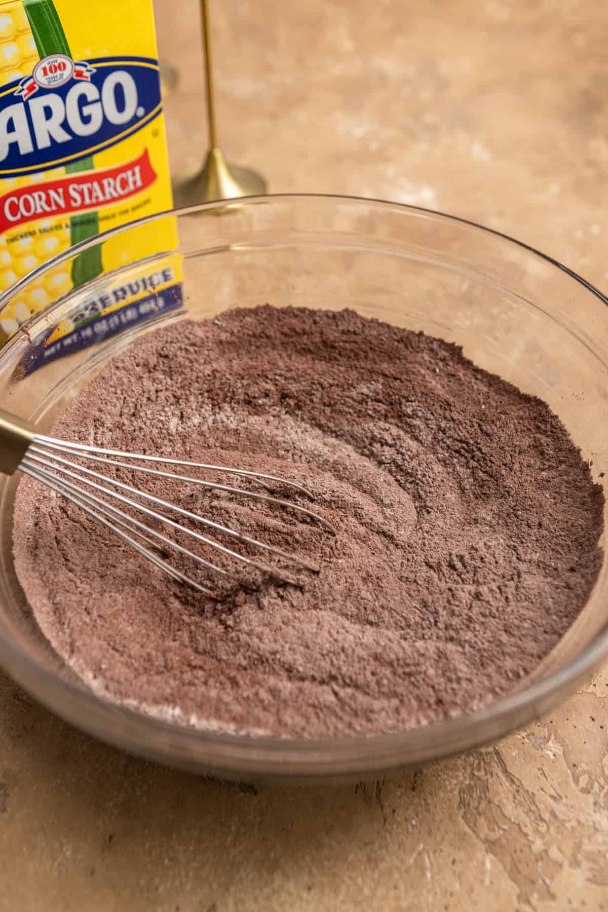 Dry ingredients mixed together in a large bowl with a whisk.