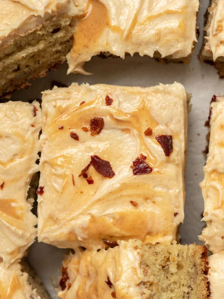 Slices of banana peanut butter cake with peanut butter swirls and bacon.
