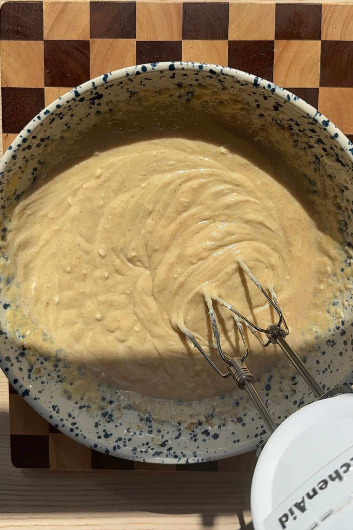 Wet ingredients for coffee cake combined in a mixing bowl.