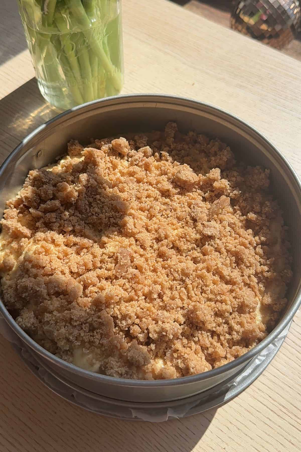 An unbaked coffee cake in a springform pan.