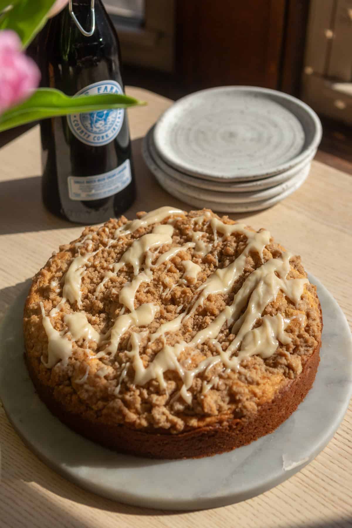 An Irish cream coffee cake on a marble platter.
