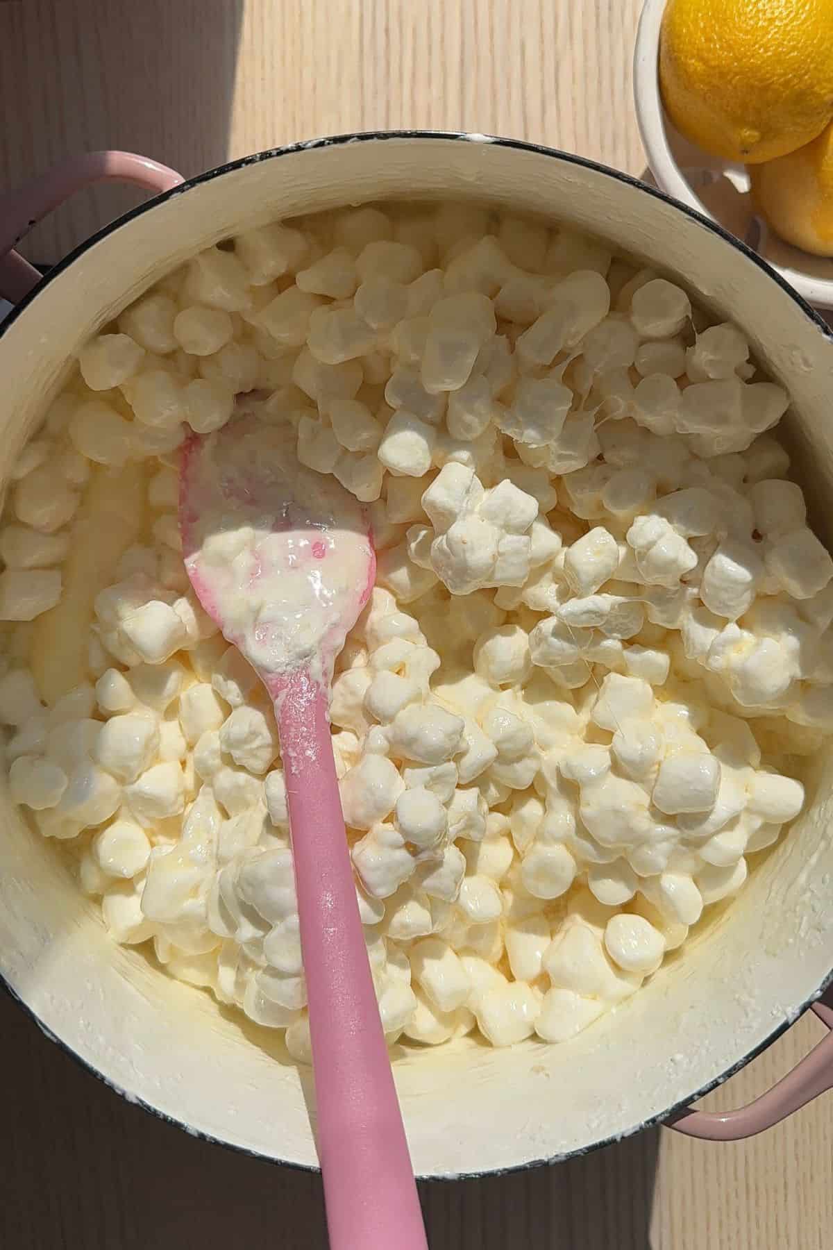 Mini marshmallows and melted butter in a large pot.