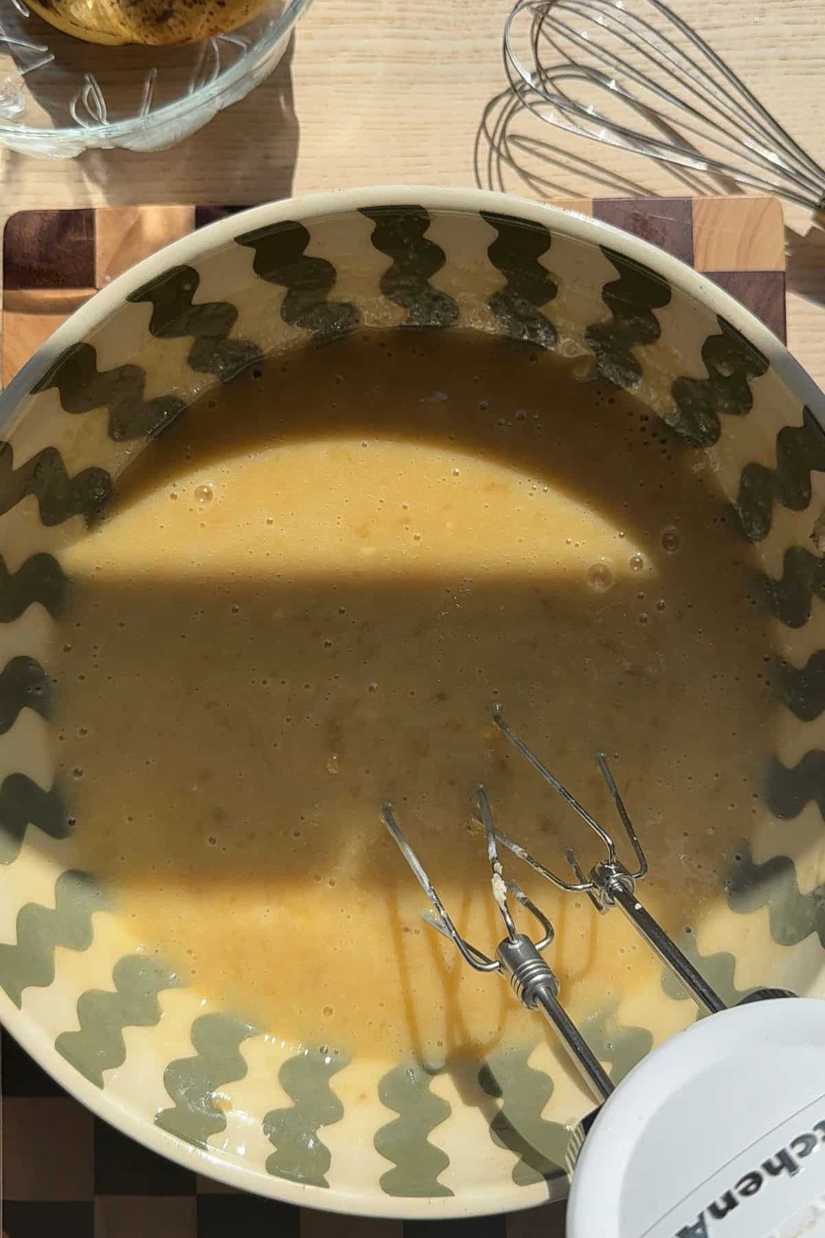 Banana bread batter in a bowl.