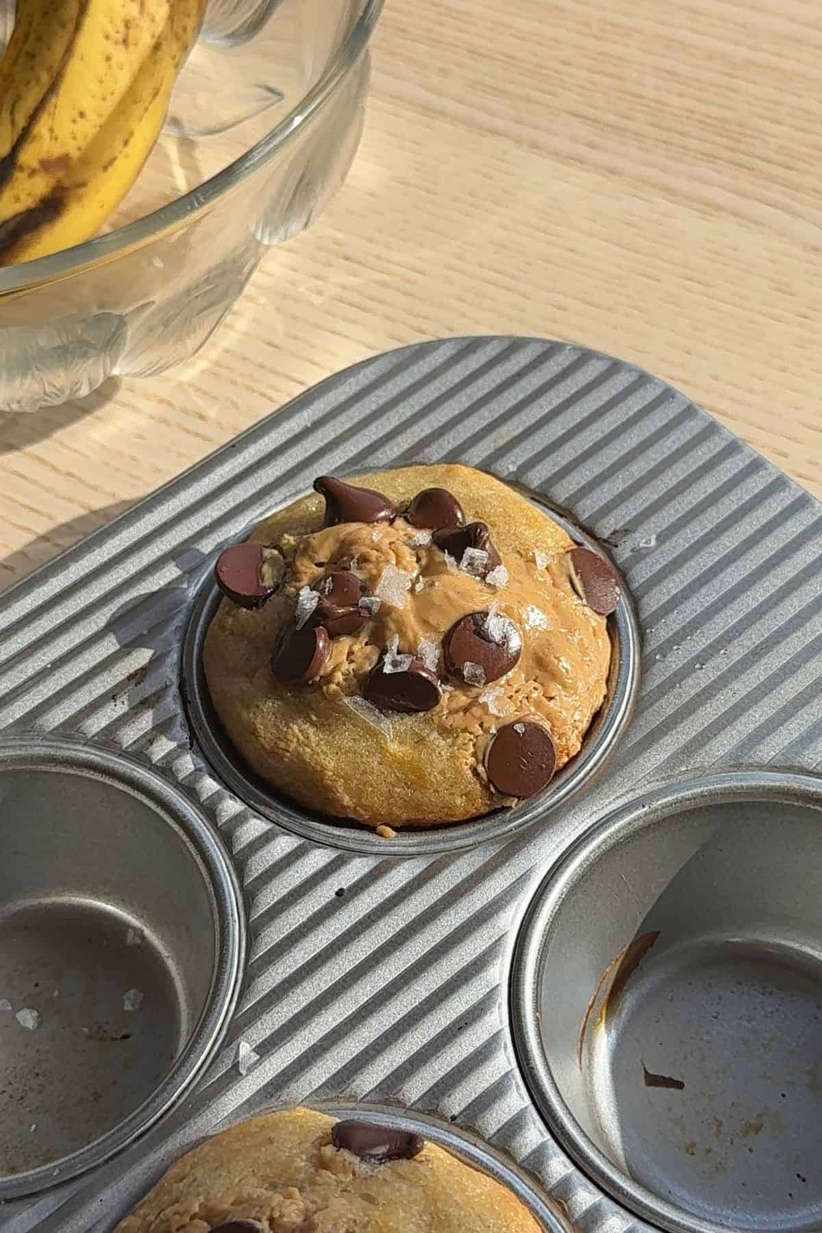 A baked muffin in a muffin tin.