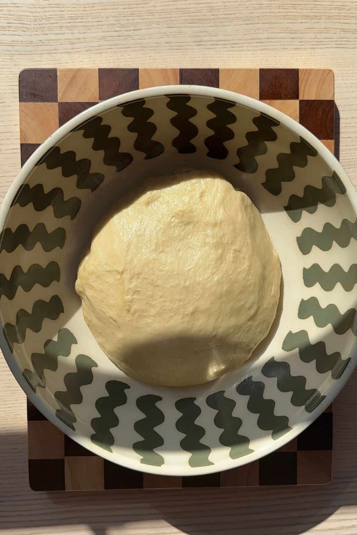 A ball of dough in a large bowl.