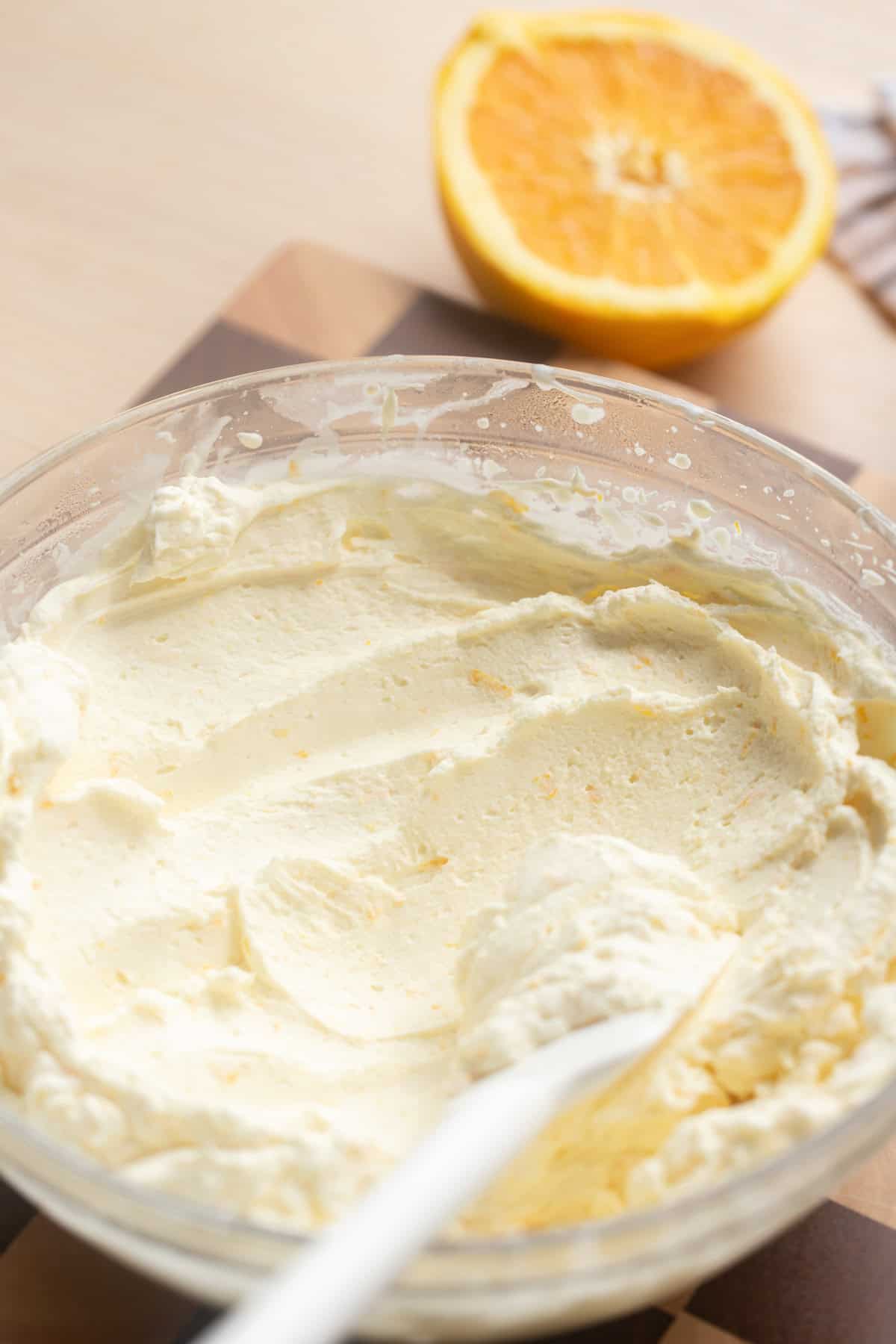 Whipped ganache in a large bowl.