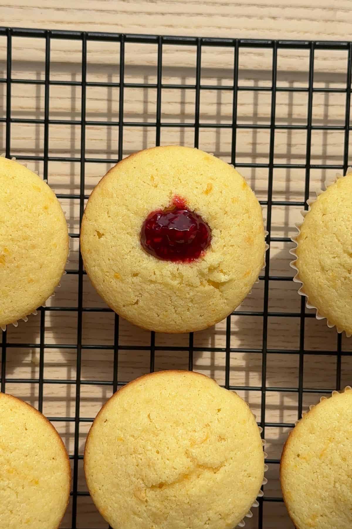The center of a cupcake filled with raspberry jam.
