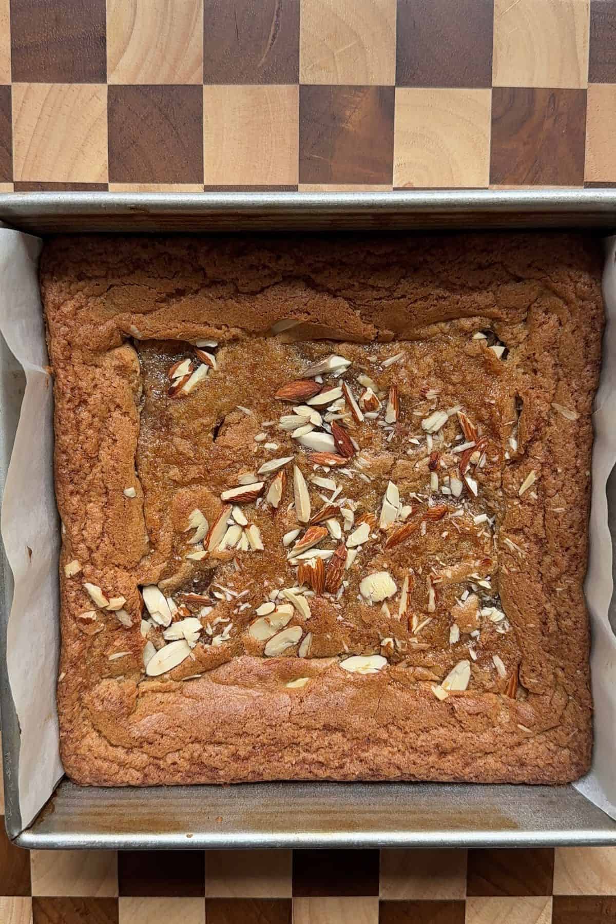 Baked blondies in a square pan.
