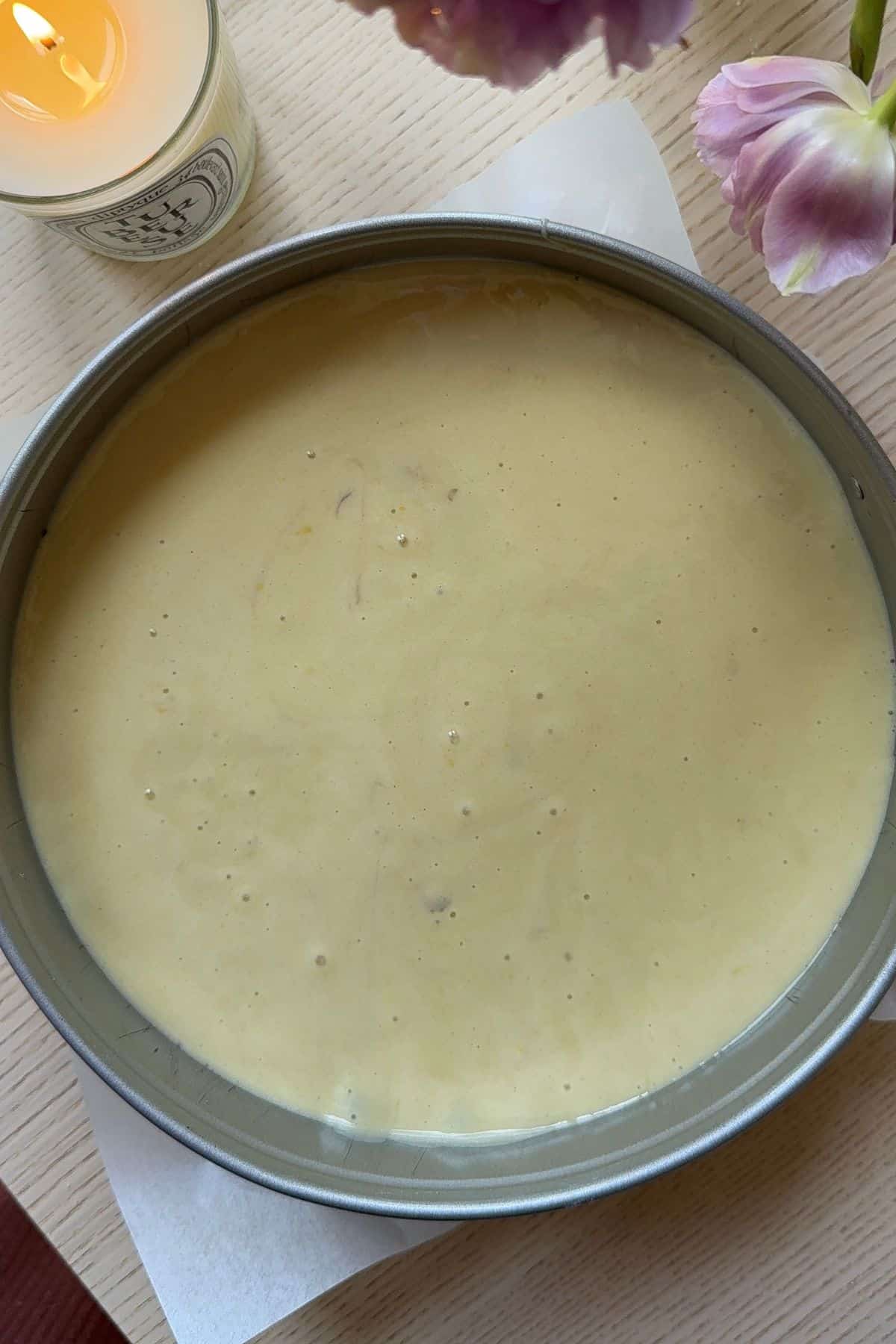 Cake batter in a springform pan.