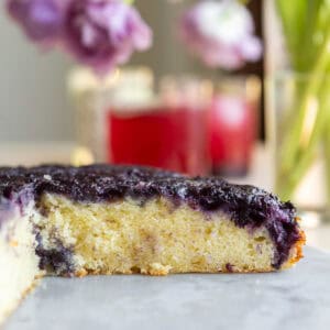 Close up of a blueberry upside down cake cut open.