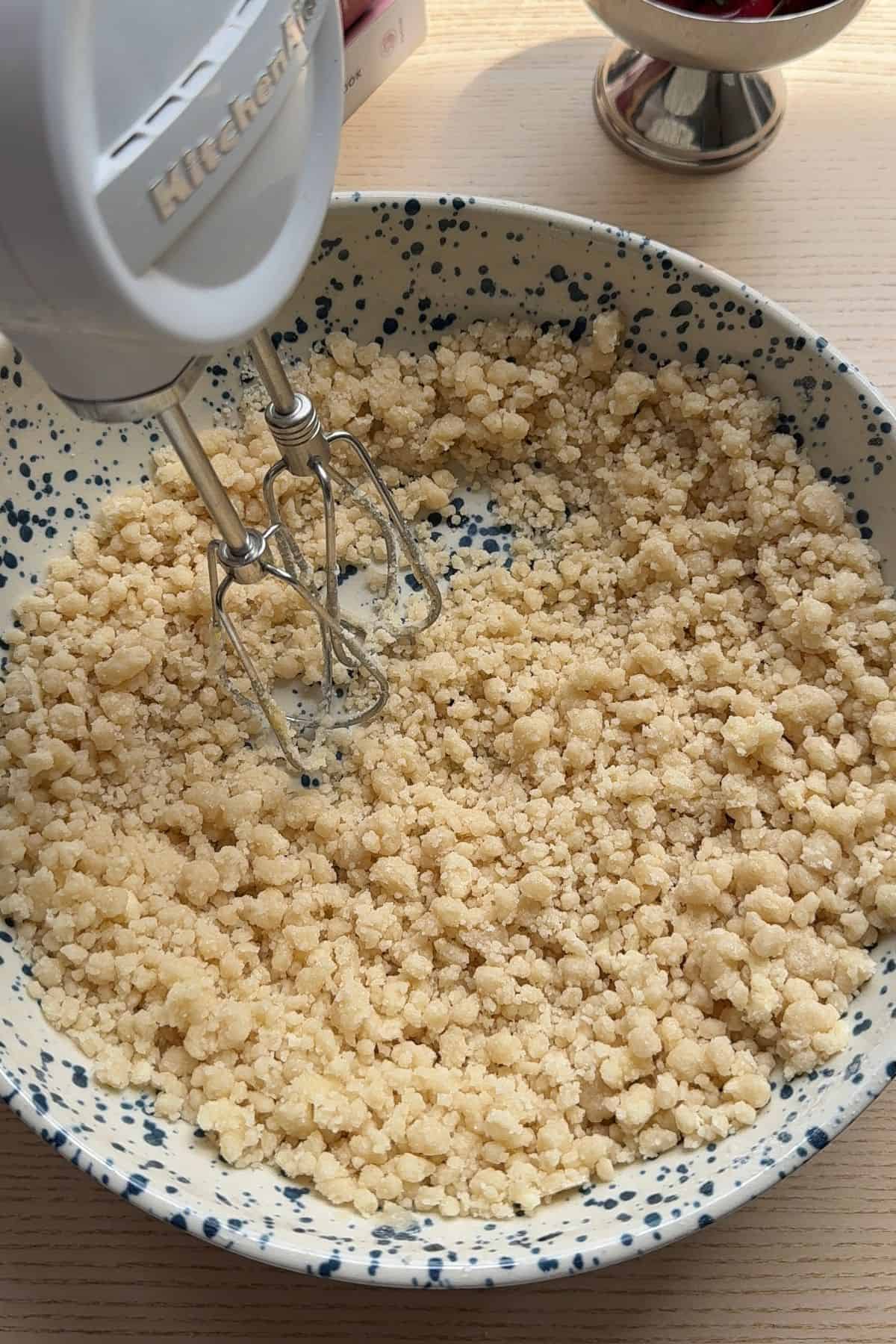 Butter and oil added to dry ingredients in a bowl.